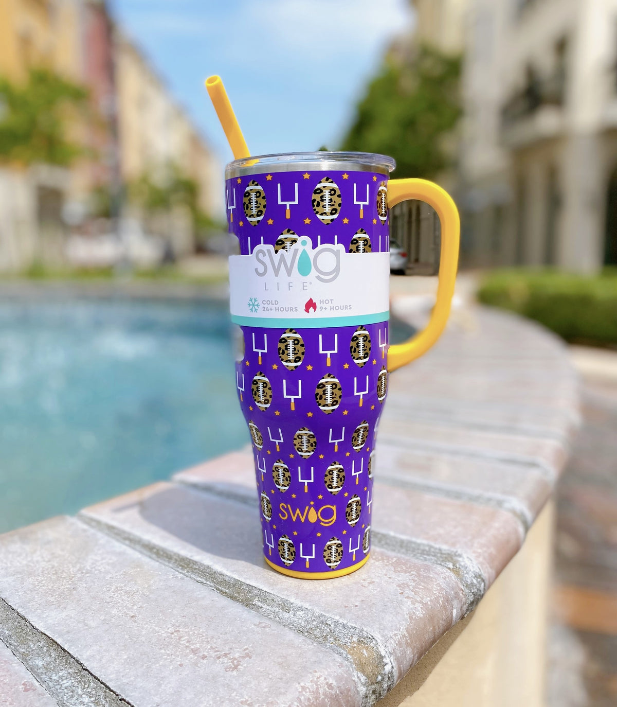 https://www.shopcarolineandco.shop/wp-content/uploads/1692/97/explore-swig-40-oz-mega-mug-touchdown-purple-gold-swig-and-many-more-shop-for-less-in-our-store_0.jpg